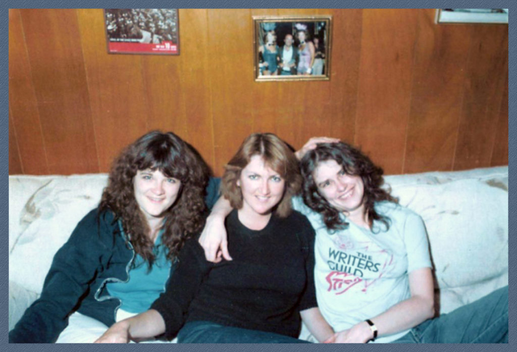 W/my sisters, wearing my Writer's Guild Strikes! tee-shirt. The WGA struck for the right to determine their own credits - and it was worth it.