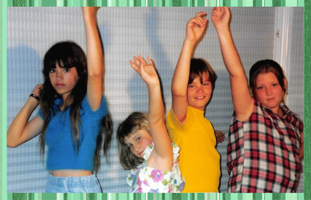 The cousins love this "Arm in the Air" salute; it shows up in a LOT of photos. I still don't know what it means. From left to right Sam, Bree, Alex and Carly.