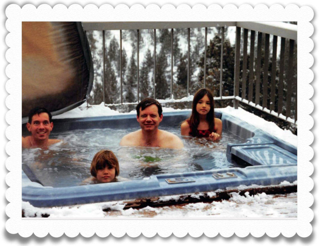 Matt, Alex, John and Sam in outdoor hot tub in the snow.