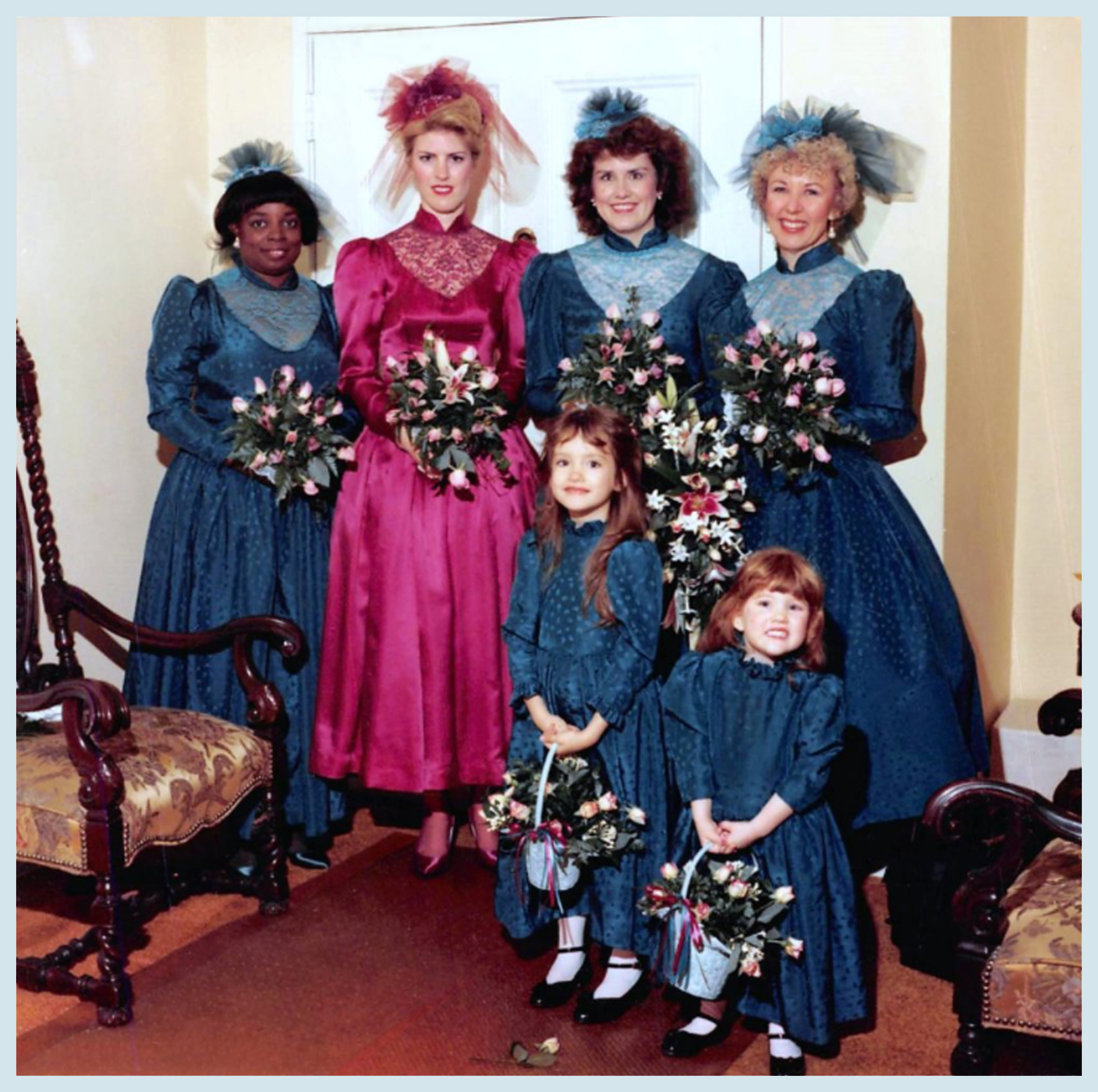 Me as bridesmaid, Sam as flower girl, in emerald-green themed dresses.