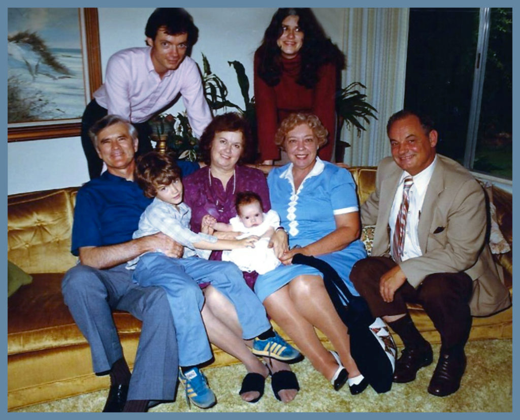 CD and Sam surrounded by both sets of grandparents and parents.