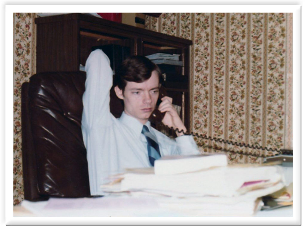 John in young workaholic lawyer mode