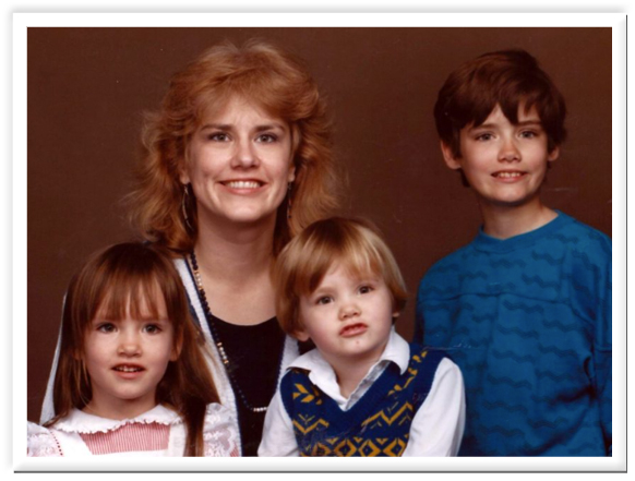 Me with the three kids. We all appear smile-challenged in this photo.