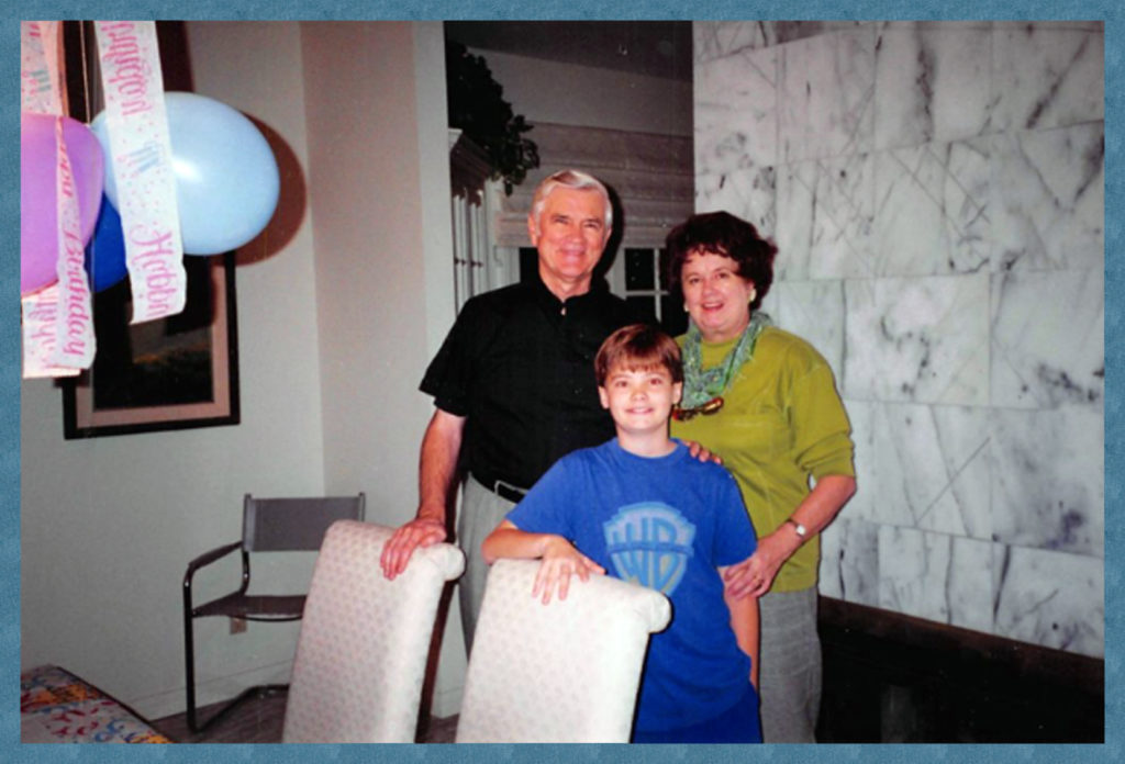 Birthday boy with his grandparents.