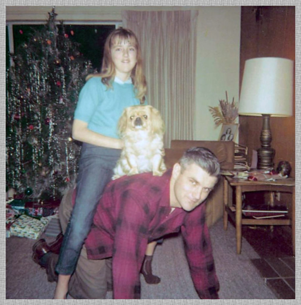 My dad giving sister Janet a horsy ride on what was probably a family night.