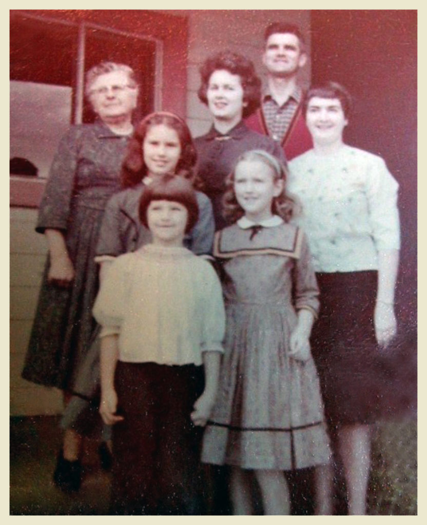 My family, my aunt June and my grandmother pose in front of the parsonage in Santa Clara.